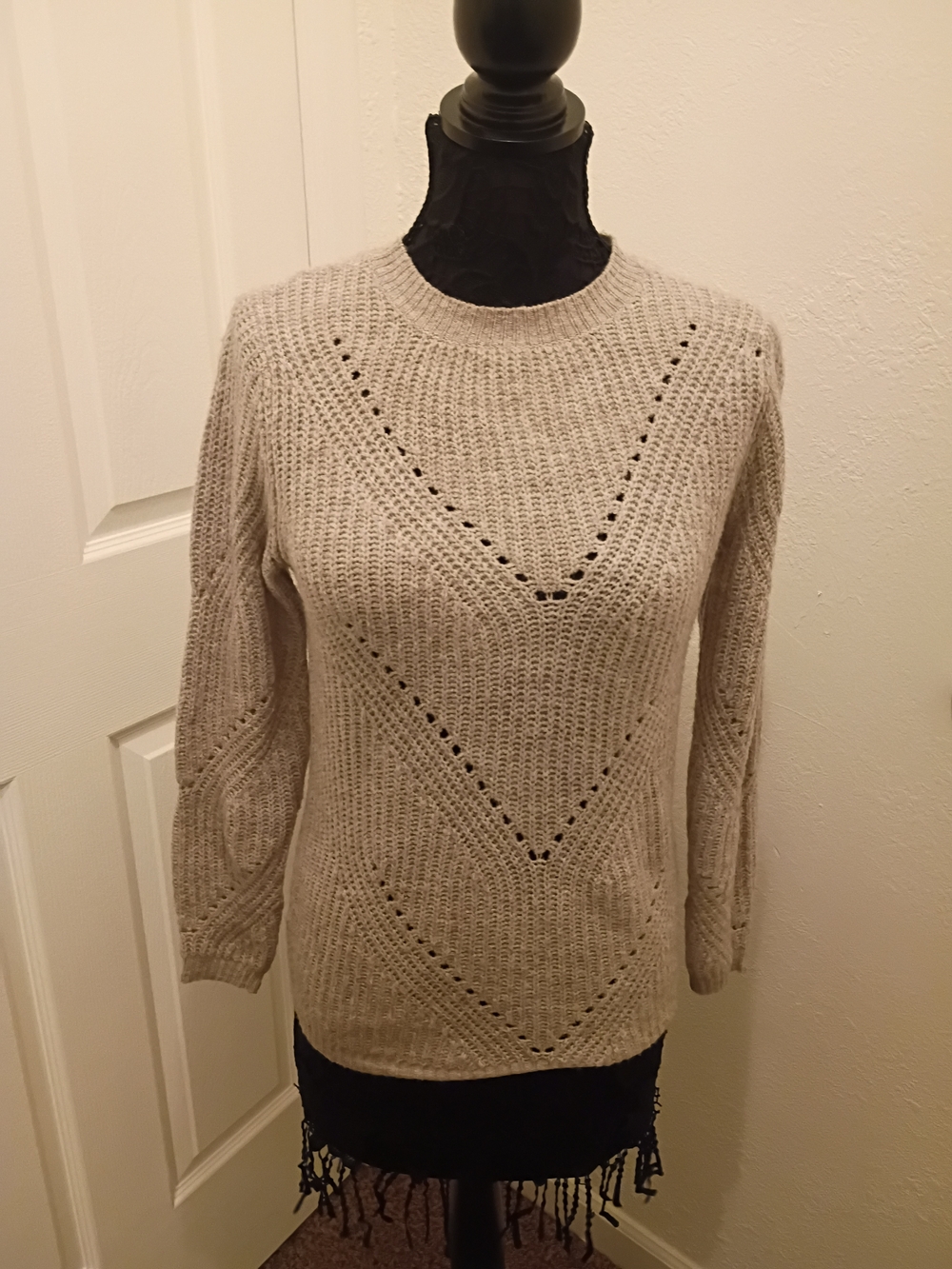medium beige crewneck sweater in a soft knit.